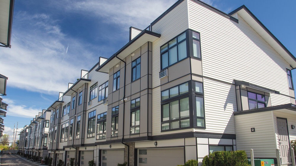 multi residential house block with a white interior and glass windows. 