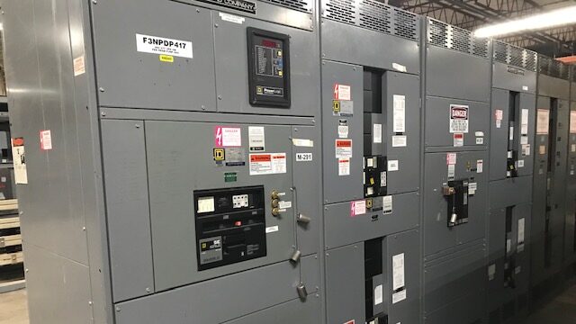 Commercial buildings electrical room with hazard stickers.