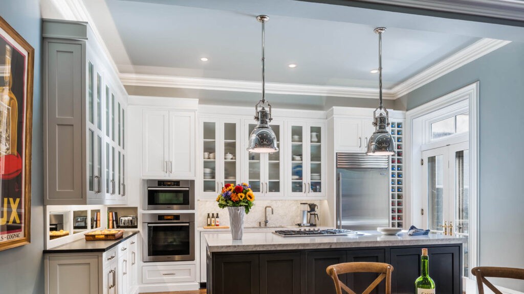 Kitchen with drop down lights hanging from the ceiling. Installed by a commercial electrician