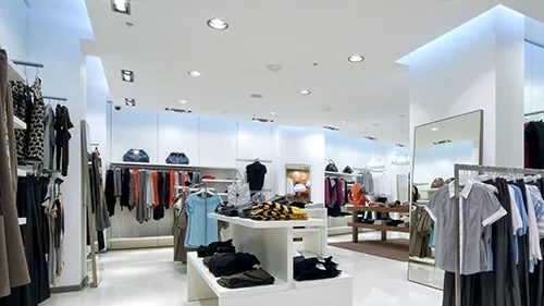 Retail store with bright pot lights installed by commercial electricians.