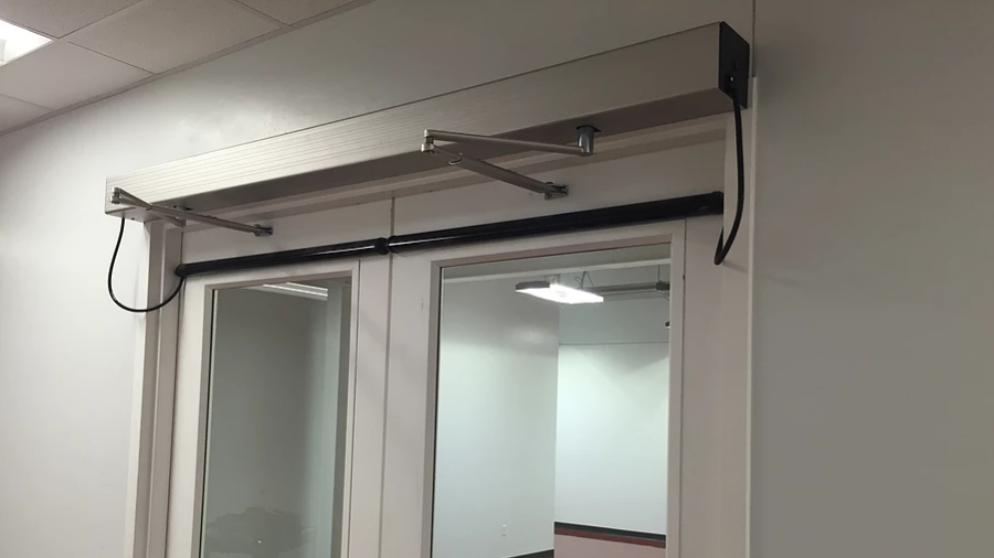 An automatic washroom door for a commercial building.