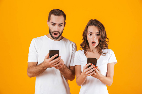 Woman and Man noticing the dangers of charging in public. 