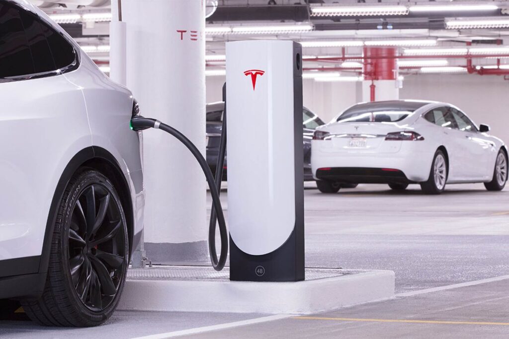 Corporation parking lot that has been upgrading to have Tesla EV Chargers.