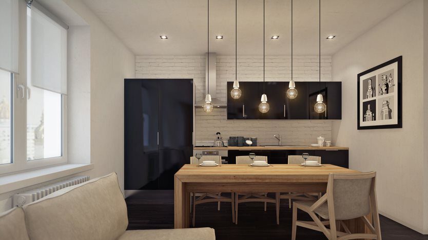 Kitchen with drop down lights hanging from the ceiling. 