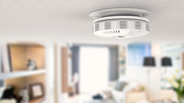 Smoke and carbon monoxide alarm that is installed in the living room of a residential home.