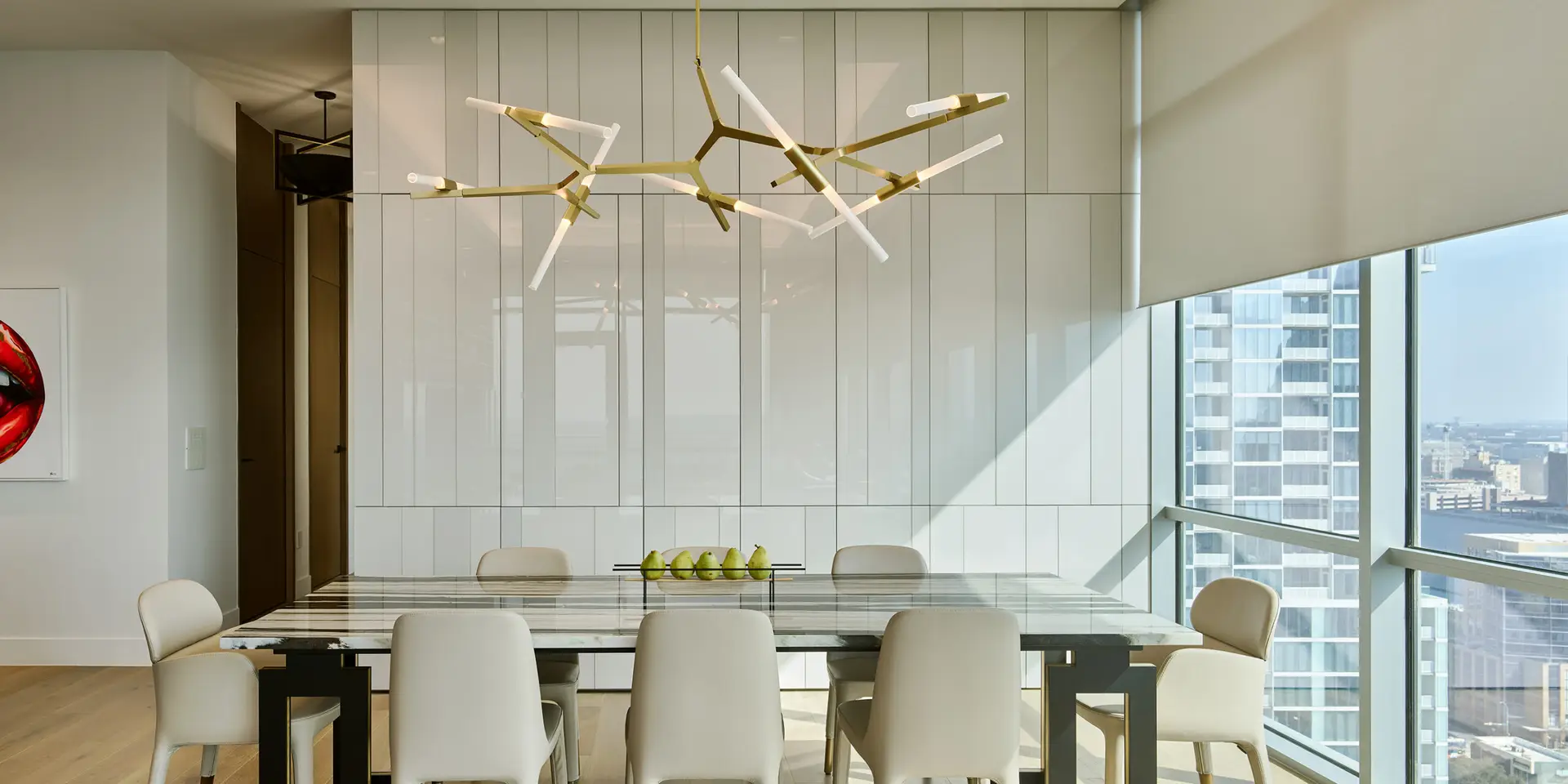 Dining room with Lutron smart lighting and automated shades