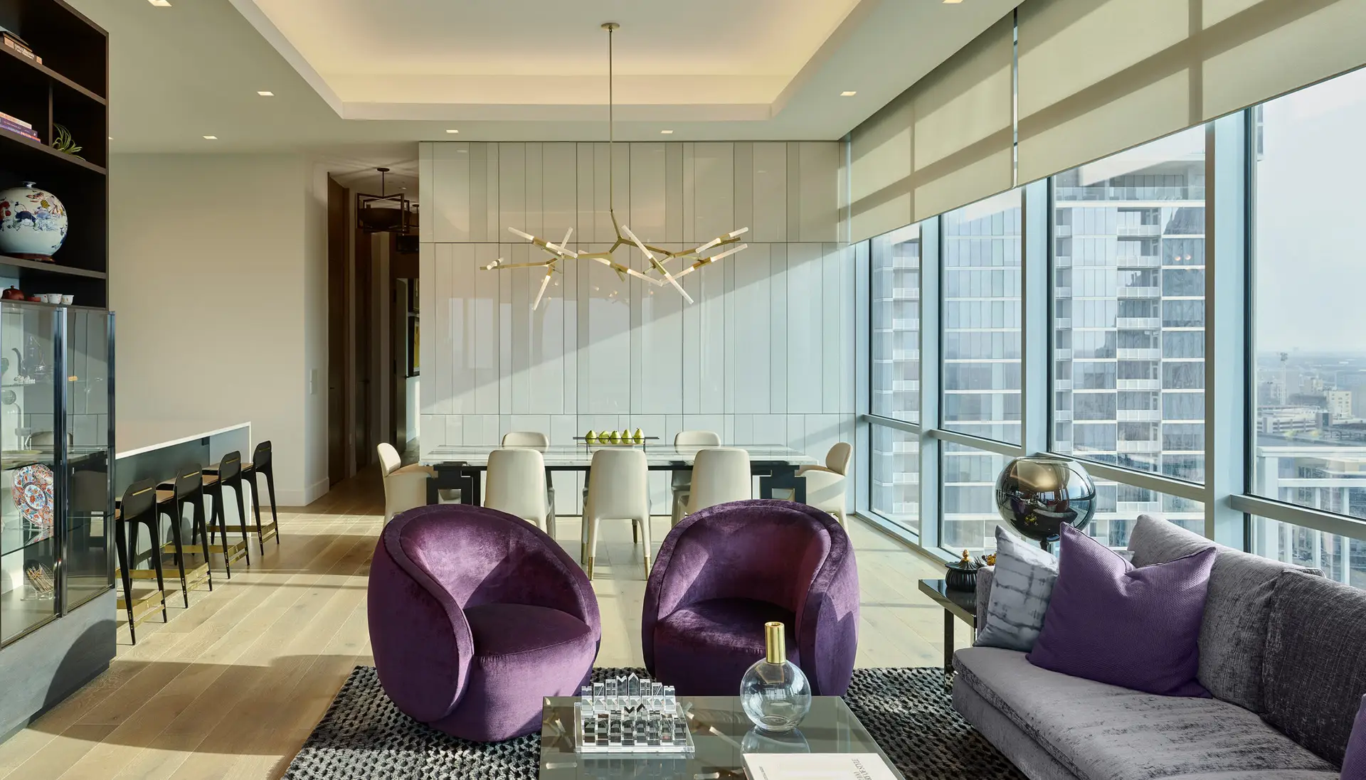 Living room with Lutron Ketra lighting and Palladiom shades