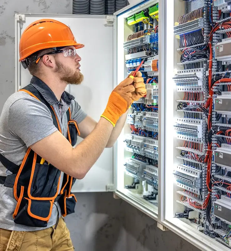 Licensed electrician working on an electrical panel