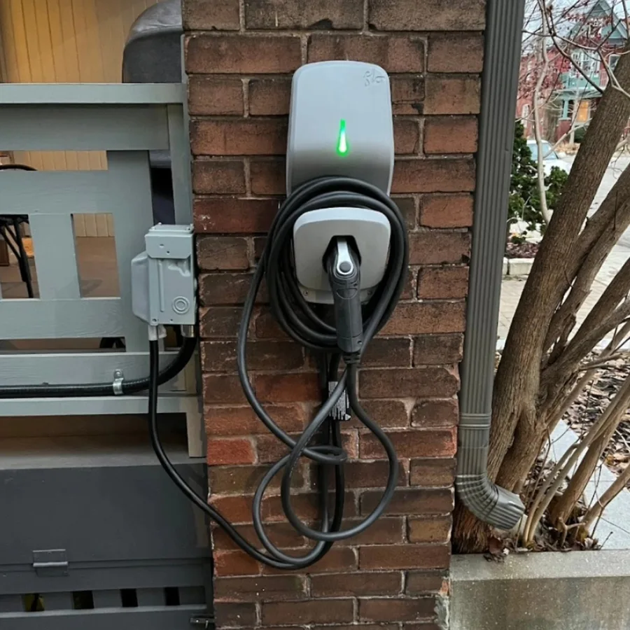 EV charger installation by 3e Electrical — FLO charger and weatherproof receptacle box on a brick pillar