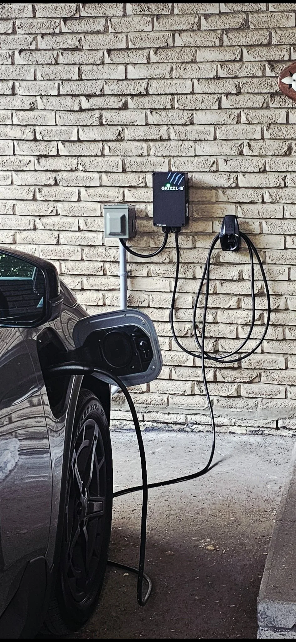 3e project in North York — Grizzl-E charger plugged into a weatherproof box fed by PVC conduit