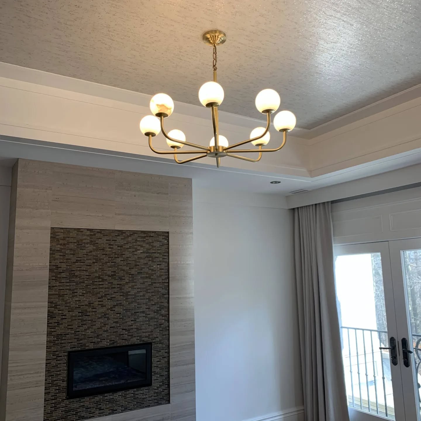 Brass chandelier installed by 3e Electrical in a Toronto home