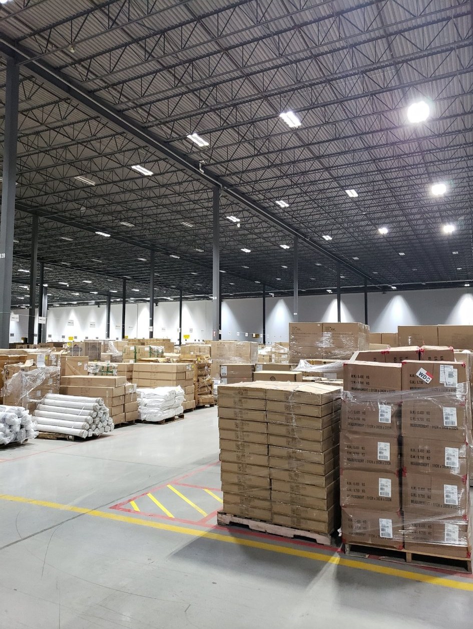 Industrial electrical contractor in Etobicoke — high-bay lighting across a working warehouse