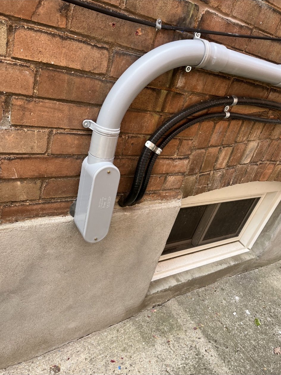 Example photo: the exterior wall of a house nearest the electrical panel