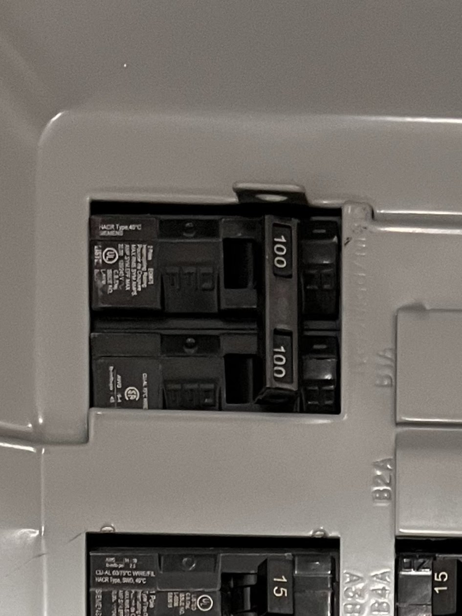 Example photo: a close-up of the main breaker showing its number