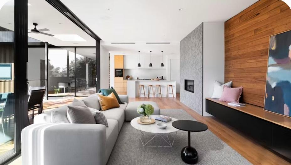 Bright renovated open-plan living room and kitchen with new lighting, Toronto